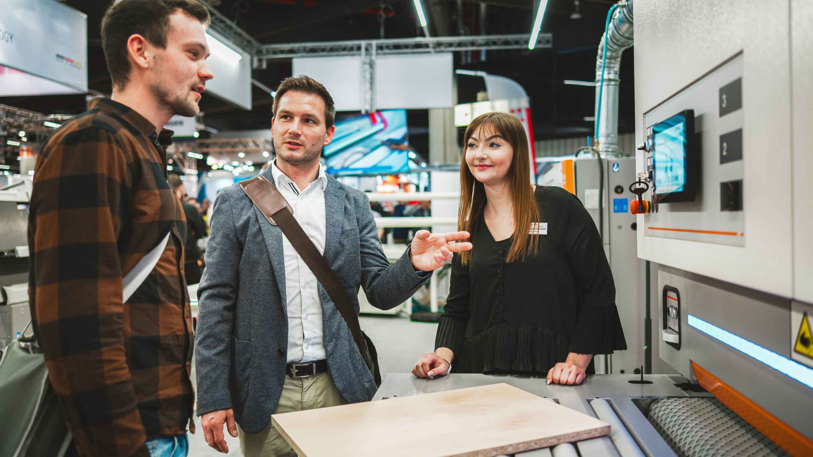 Visitors at a woodworking machine